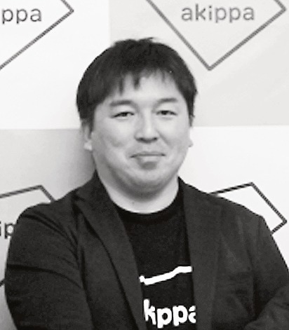 開発発表会でサービスに自信を見せる金谷社長