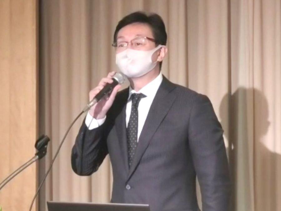 講演する国交省の三浦逸広不動産業課長