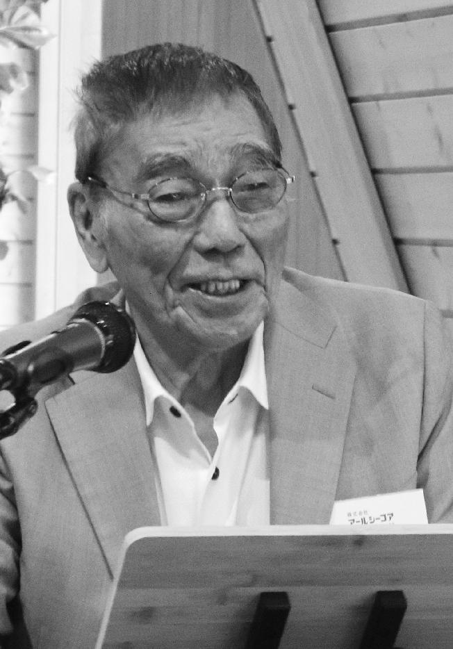 経営ビジョン発表会の冒頭挨拶する二木浩三新会長((左))と今後の経営方針について語る壽松木康晴新社長