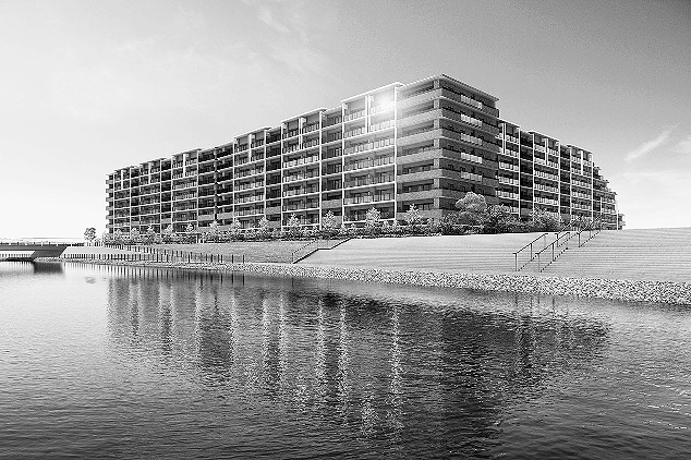 南東側から見た建物外観。手前は調節池